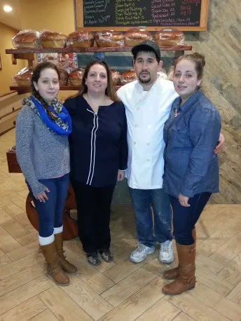 The Barcelos Bakery family: Sara, her daughters and Antonio in his baker's whites